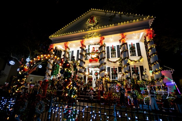 The stately Celebration home of Vernon and Victoria Lindo features many Santa figures, carolers, a Nativity scene and more at 618 Golfpark Drive in Celebration on Dec. 8, 2025. (Patrick Connolly/Orlando Sentinel)