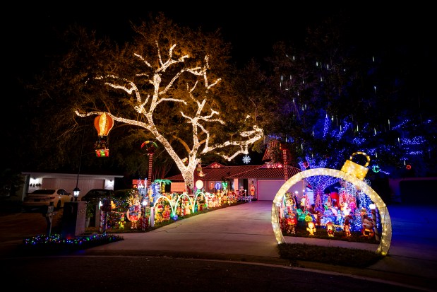Cross Christmas is back for the family's annual Christmas lights tradition at 4241 N. Econlockhatchee Trail in Orlando on Dec. 10, 2025. (Patrick Connolly/Orlando Sentinel)