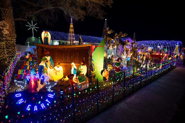 This year marks the final year for the Fye's Crazy Christmas House at 407 Eagle Circle in Casselberry on Dec. 10, 2025. The display features 60,000 lights and a life-size sleigh for photo ops. (Patrick Connolly/Orlando Sentinel)