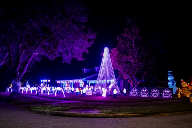 Bivona Lights is illuminated with lights that dance to music, including EDM remixes of Christmas songs, at 1601 N. Wind Court in Winter Springs on Dec. 10, 2025. (Patrick Connolly/Orlando Sentinel)