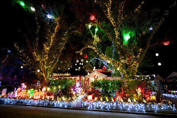 The home at 1502 Oakley St. in Orlando features thousands of lights and cheerful Christmas characters on Dec. 14, 2025. (Patrick Connolly/Orlando Sentinel)