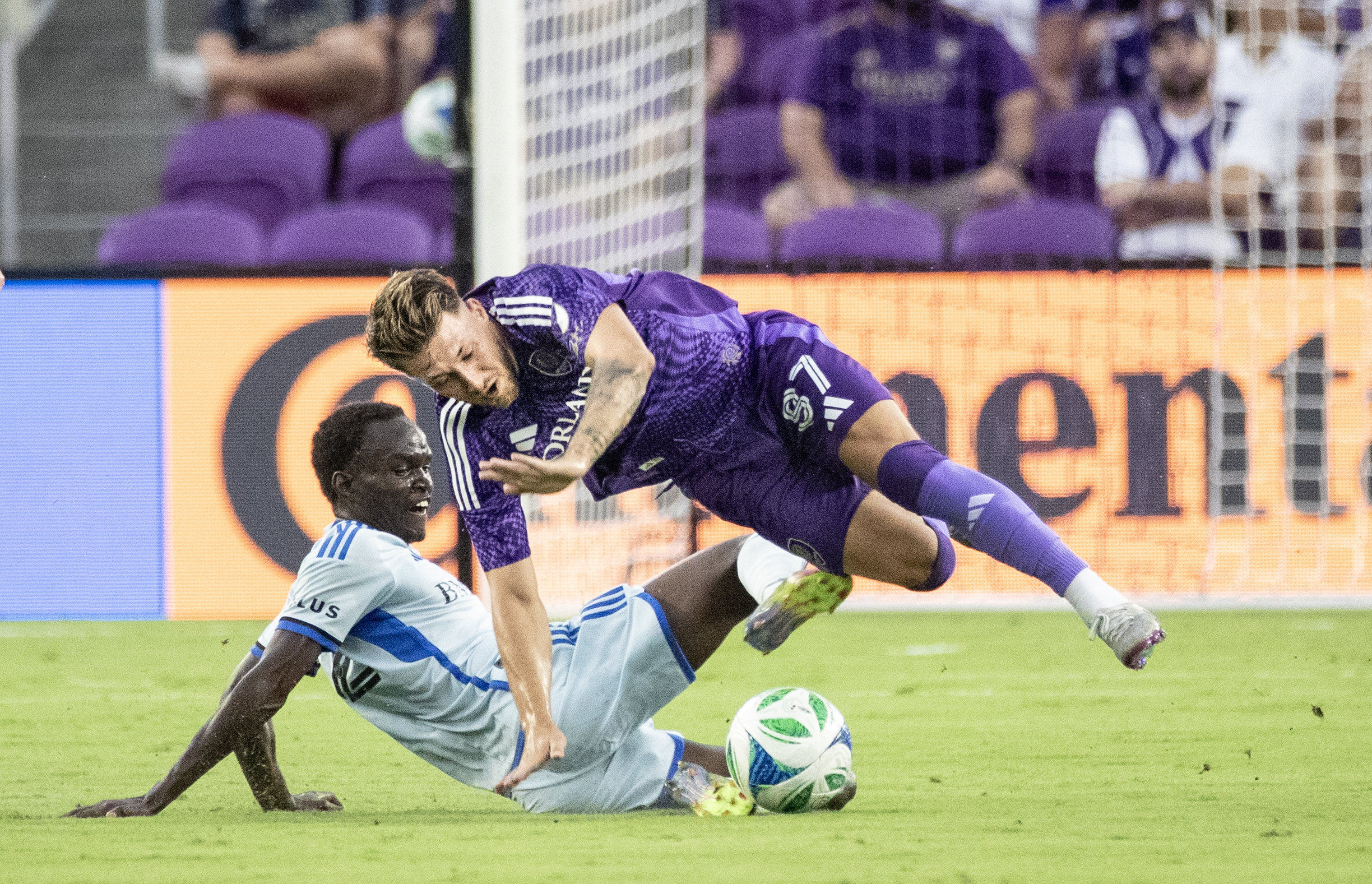 Orlando City forward Marco PaÅ¡aliÄ (87) is up ended by...