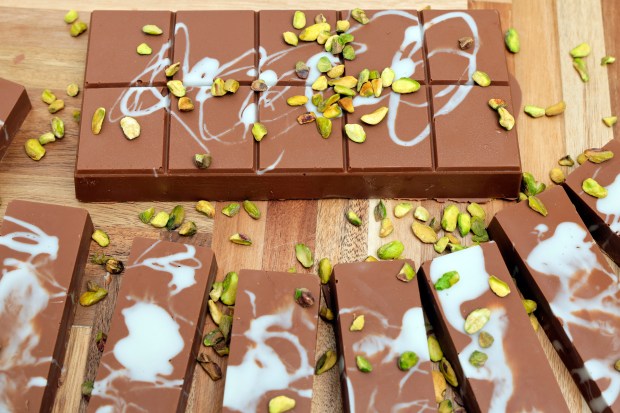 Dubai Chocolate bars are displayed at Sultan Nut House in Plantation. Dubai chocolate has taken over South Florida bakeries and chocolatiers as a top-seller after viral on TikTok. A large, 18-ounce bar sells for $35 and the smaller, 3-ounce bars are $12.99. (Amy Beth Bennett / South Florida Sun Sentinel)