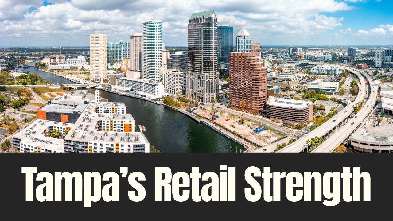 Aerial view of downtown Tampa showing the Hillsborough River, Riverwalk, office towers and surrounding commercial development.