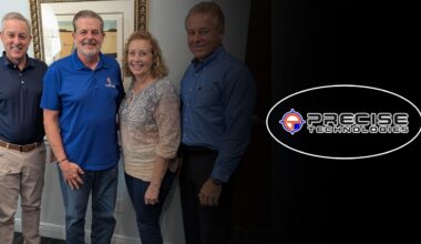 Todd Kuykendall, Dave Schwanke, Tara Schwanke and Edward Valaitis stand together following the sale of Precise Technologies Inc. in Largo.