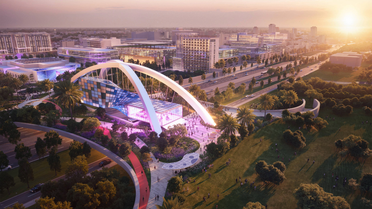 Rendering of the Gas Plant District Gateway at 13th Street with modern buildings, palm trees, and a pedestrian-friendly plaza at sunset.