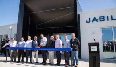 Jabil executives and local leaders take part in a ribbon-cutting at a Jabil facility in Tampa Bay