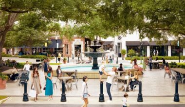 Shoppers and diners gather around the central fountain at Hyde Park Village in Tampa