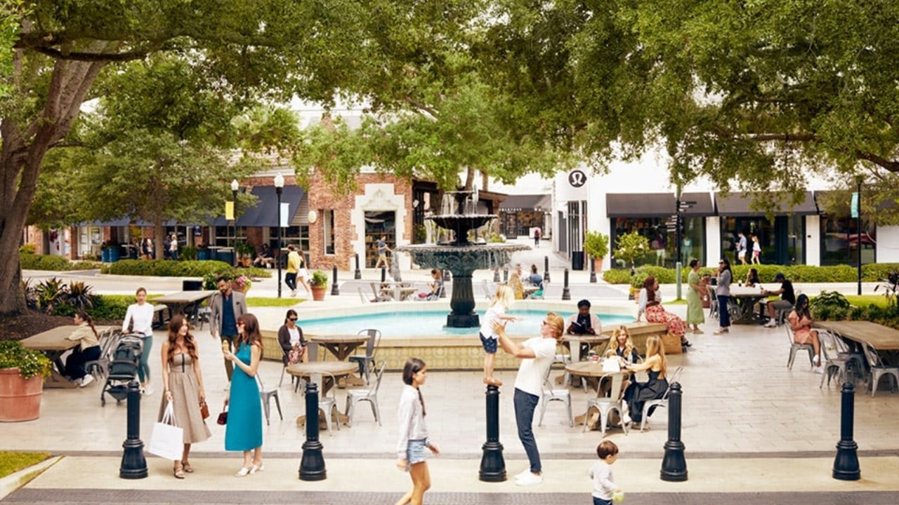 Shoppers and diners gather around the central fountain at Hyde Park Village in Tampa