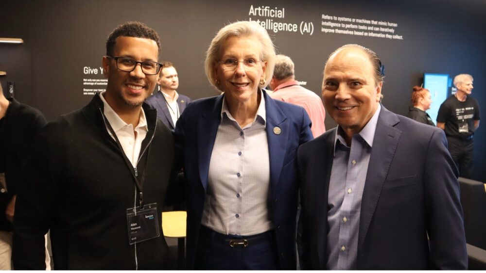 Business and technology leaders stand inside The Digital Suite Tampa during the launch event at Embarc Collective.