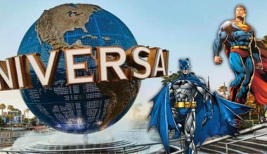 The iconic Universal Studios globe with Batman and Superman welcoming guests at the Universal Orlando park entrance.
