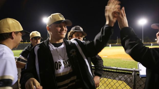 Joe Skinner high fives teammates during a 2016 Bishop Moore game. Skinner, who was committed to play college baseball at UCF, died after battling leukemia. He is being honored by the UCF baseball team Friday.