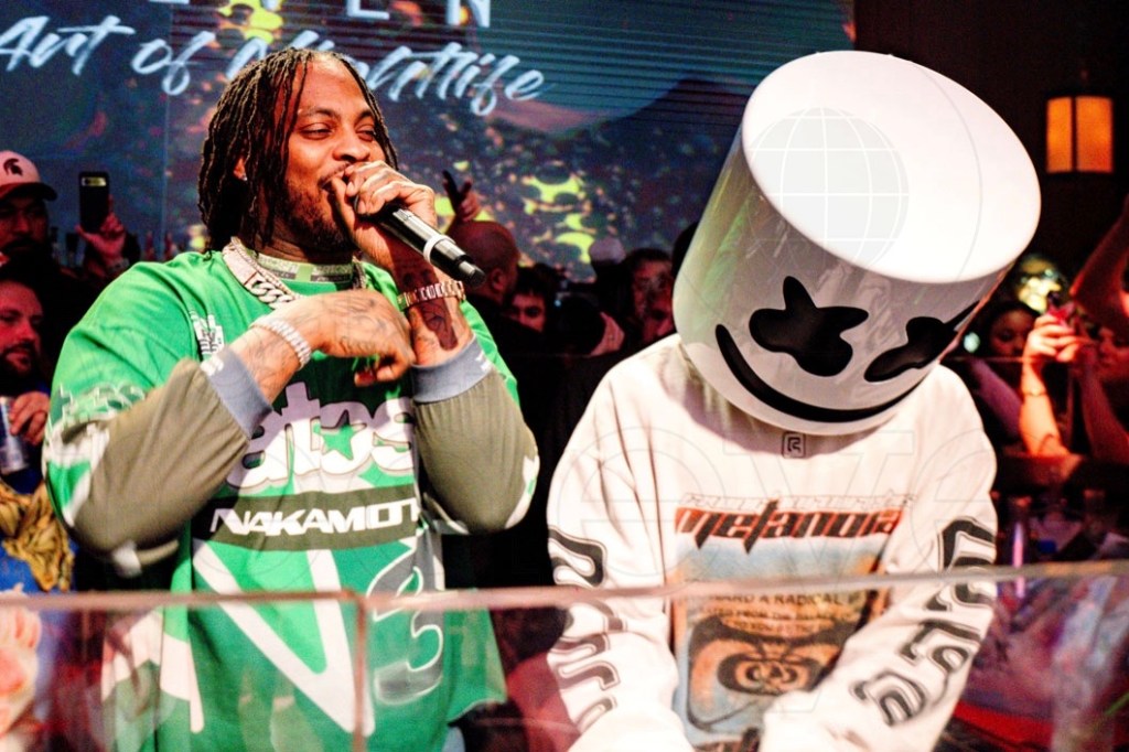 Photo of Waka Flocka Flame and Marshmello performing behind a DJ booth