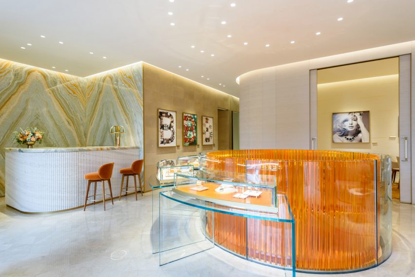 A cylinder of orange acrylic batons at the centre of a jewellery boutique