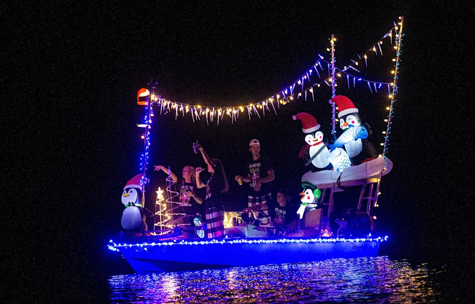 Boats participate in the annual Fort Myers Beach Christmas Boat Parade on Saturday, Dec. 2, 2023. The event was cancelled last year due to Hurricane Ian. People lined the shores and bridge to watch the annual event.