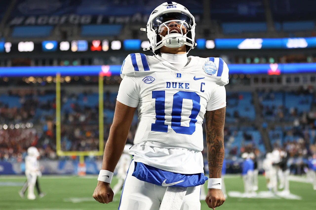 CHARLOTTE, NC - DECEMBER 06: Duke Blue Devils quarterback Darian Mensah (10) celebrates during the ACC Football Championship game between the Virginia Cavaliers and the Duke Blue Devils on December 6, 2025, at Bank of America Stadium in Charlotte, North Carolina. (Photo by Daniel Kucin Jr./Icon Sportswire via Getty Images)