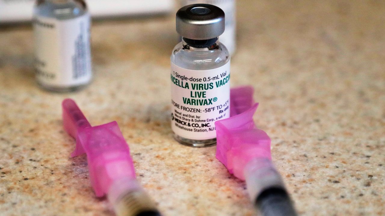 A chickenpox (also known as varicella) vaccine sits next to syringes and ready for a student at a free immunization clinic. (File photo)