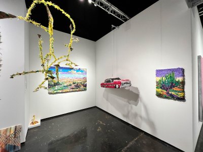 Sculptures and wall-hung works made with colored tissue paper.