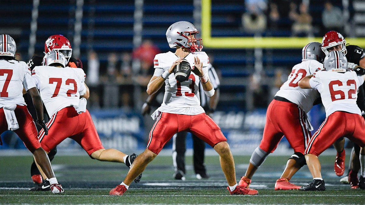 A Lake Mary quarterback looks to throw in the FHSAA Class 7A state championship, Dec. 13, 2025, at Pitbull Stadium in Miami.