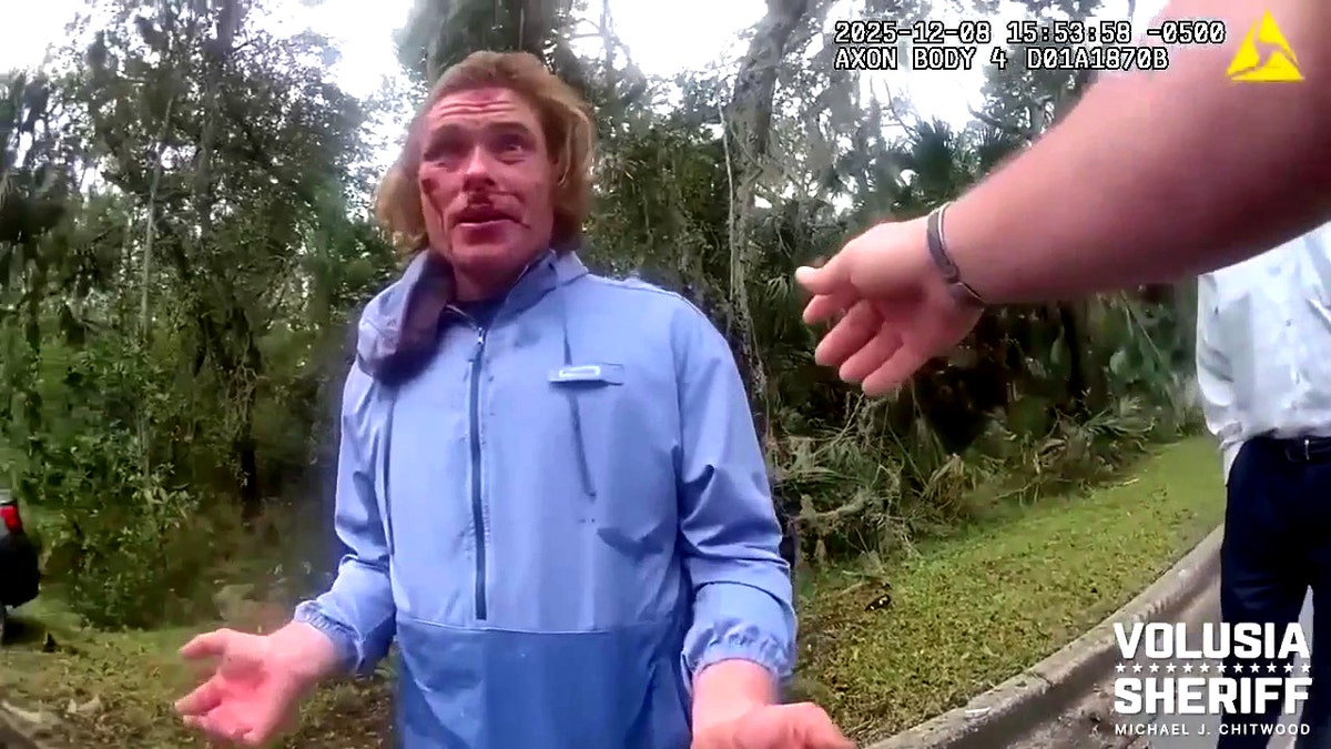 Calvin Curtis Johnson speaking with deputy