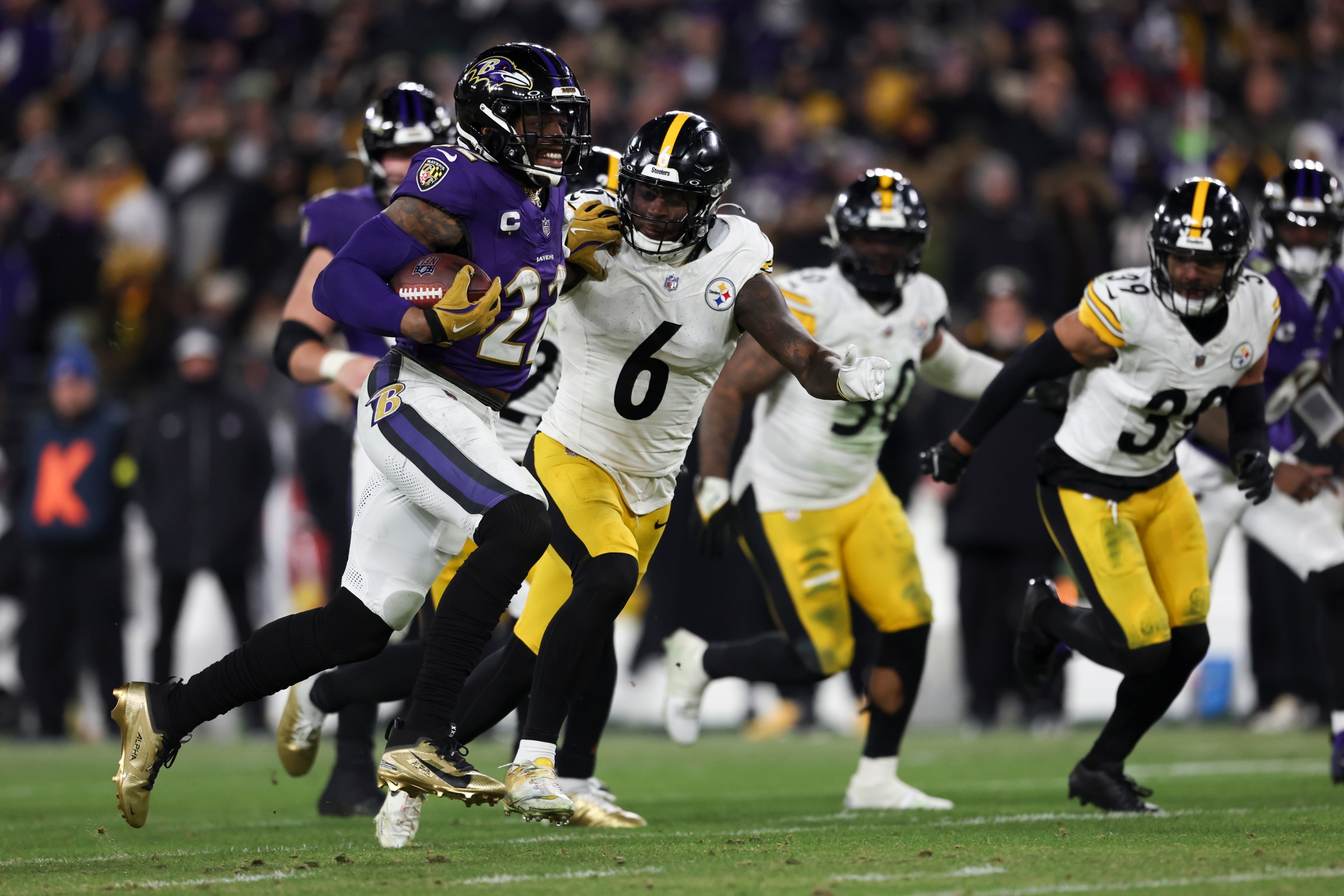 BALTIMORE, MARYLAND - JANUARY 11: Derrick Henry #22 of the Baltimore Ravens runs the ball for a touchdown during a Wild Card Playoff Game against the Pittsburgh Steelers at M&T Bank Stadium on January 11, 2025 in Baltimore, Maryland. The Ravens defeated the Steelers 28-14. (Kara Durrette/Getty Images)