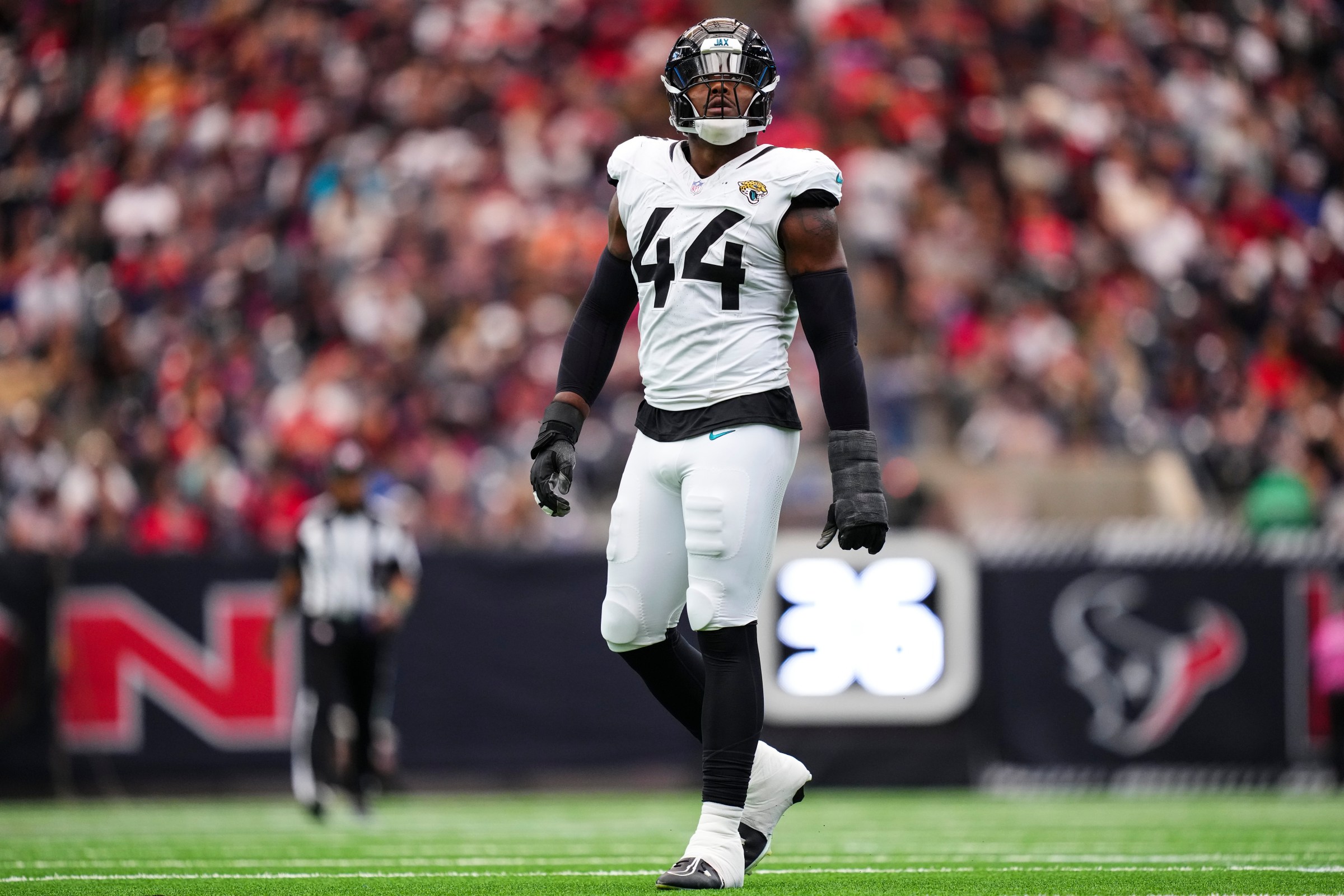HOUSTON, TX - NOVEMBER 09: Travon Walker #44 of the Jacksonville Jaguars looks on from the field during an NFL football game against the Houston Texans at NRG Stadium on November 9, 2025 in Houston, Texas. (Photo by Cooper Neill/Getty Images)
