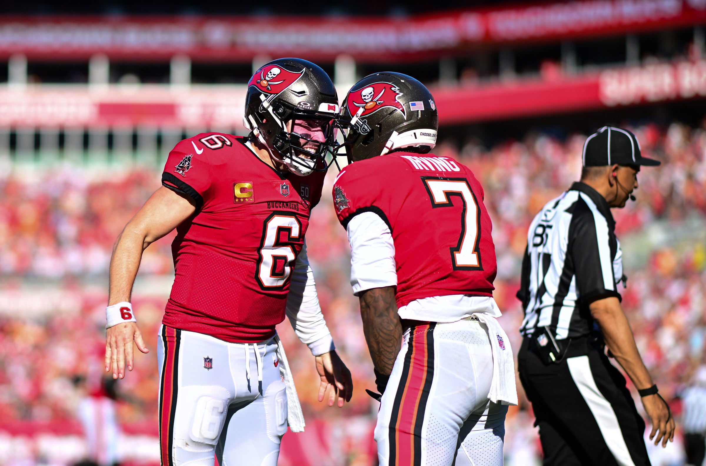 TAMPA, FLORIDA - NOVEMBER 30: Baker Mayfield #6 and Bucky Irving #7 of the Tampa Bay Buccaneers celebrates a touchdown against the Arizona Cardinals during the third quarter at Raymond James Stadium on November 30, 2025 in Tampa, Florida. (Photo by Julio Aguilar/Getty Images)