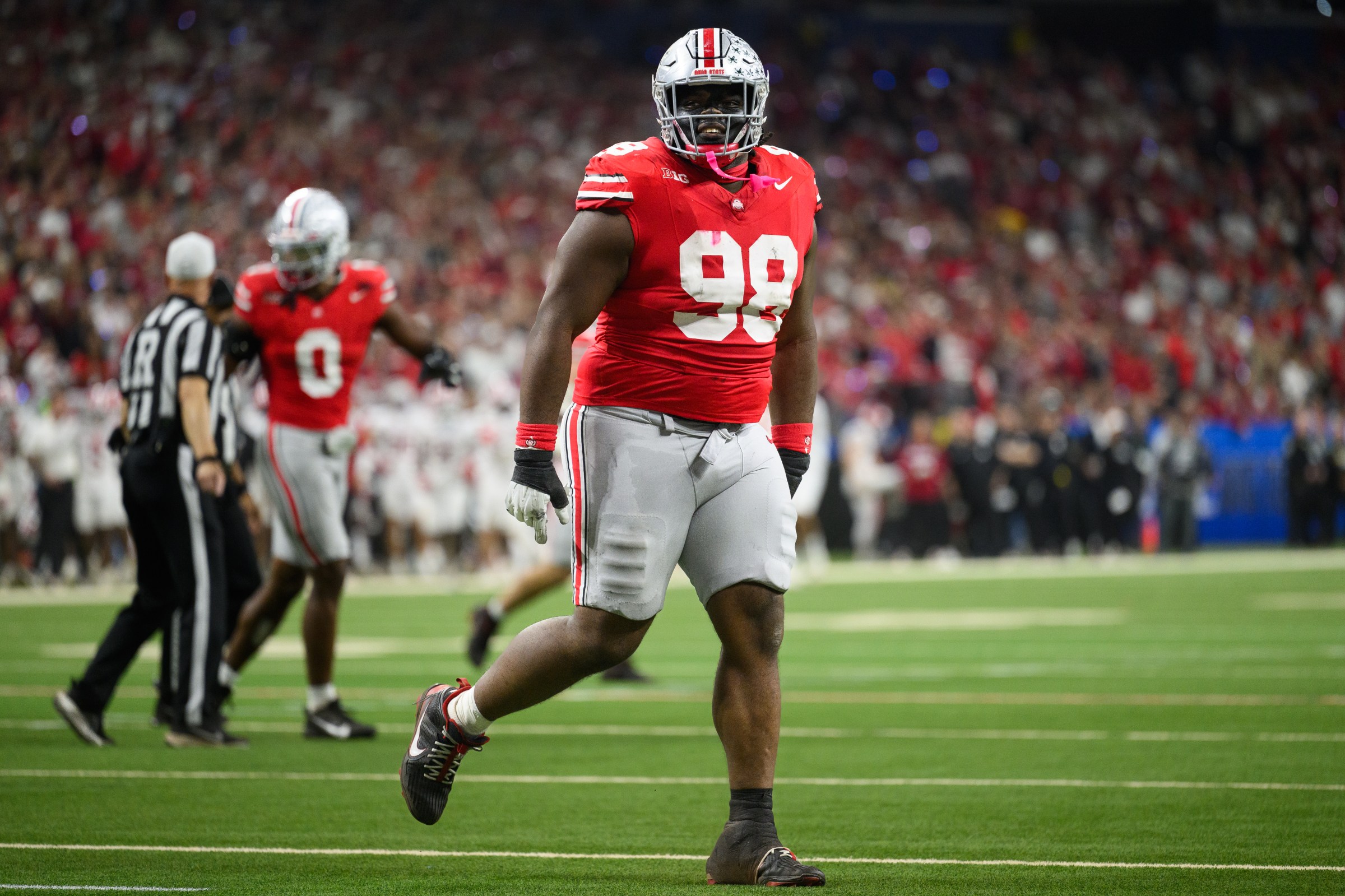 INDIANAPOLIS, IN - DECEMBER 06: Ohio State Buckeyes defensive lineman Kayden McDonald (98) celebrates a turnover during the Big 10 Championship game between the Ohio State Buckeyes and Indiana Hoosiers on December 6, 2025, at Lucas Oil Stadium in Indianapolis, IN. (Photo by Zach Bolinger/Icon Sportswire via Getty Images)