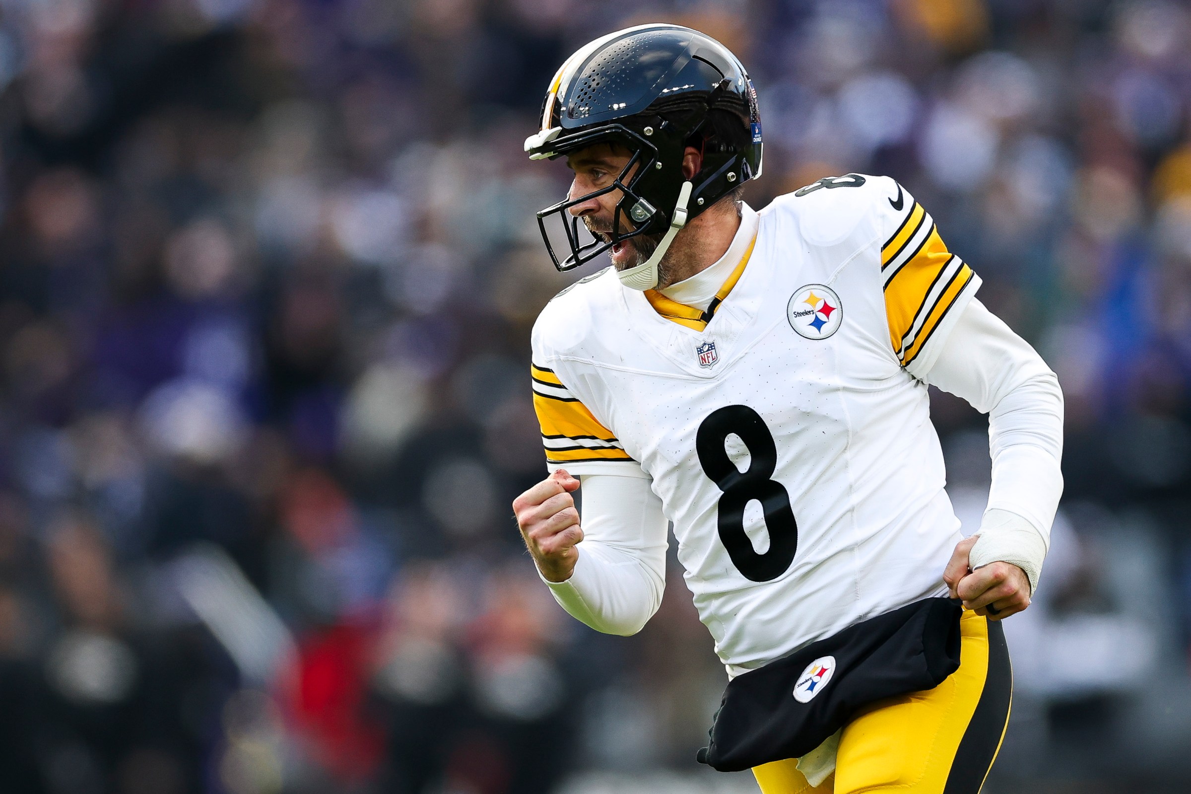 BALTIMORE, MARYLAND - DECEMBER 07: Aaron Rodgers #8 of the Pittsburgh Steelers celebrates a third quarter touchdown against the Baltimore Ravens at M&T Bank Stadium on December 07, 2025 in Baltimore, Maryland. (Photo by Patrick Smith/Getty Images)