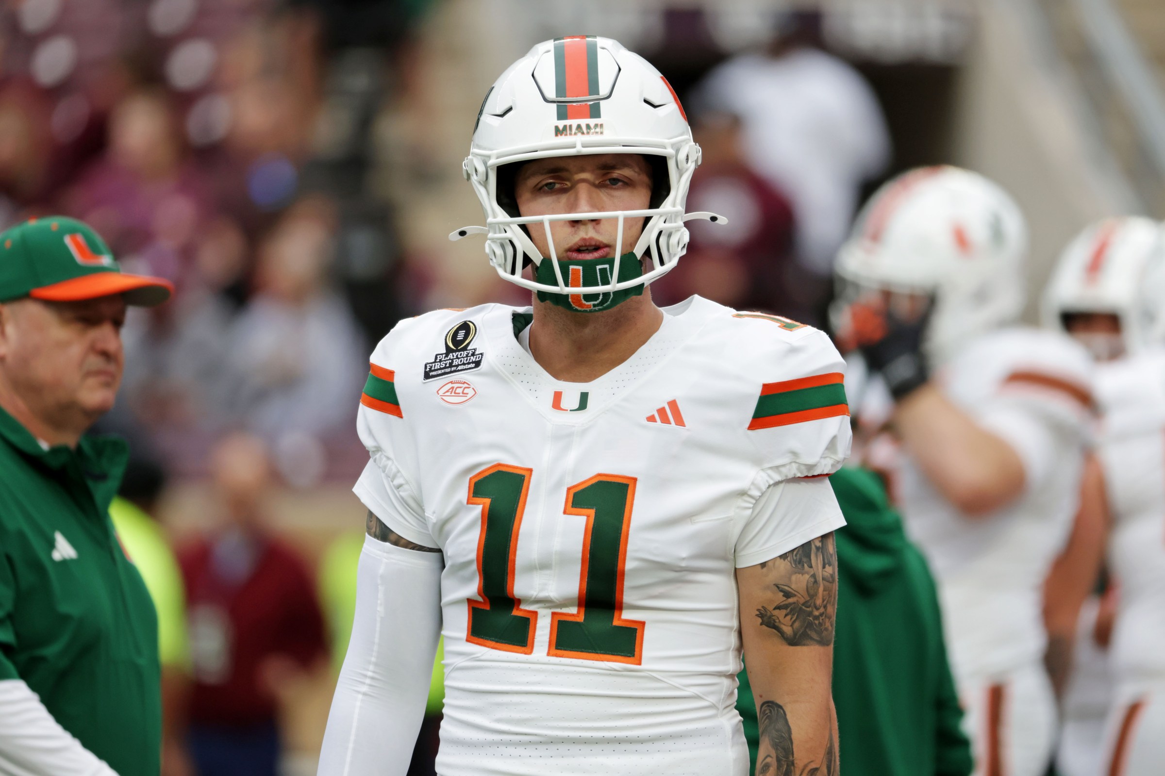 COLLEGE STATION, TEXAS - DECEMBER 20: Carson Beck (11) of the Miami (FL) Hurricanes warms up before the game against the Texas A&M Aggies at Kyle Field on December 20, 2025 in College Station, Texas. (Photo by CFP/Getty Images)