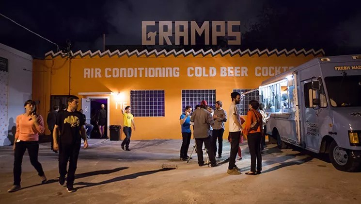 Photo of the outside of a local venue with orange walls and a sign that reads Gramps.