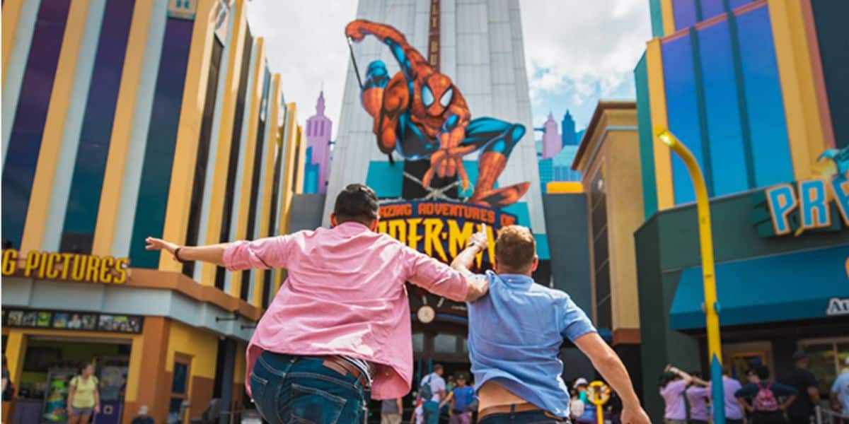 guests run toward adventures of spider-man ride at universal orlando resort's islands of adventure