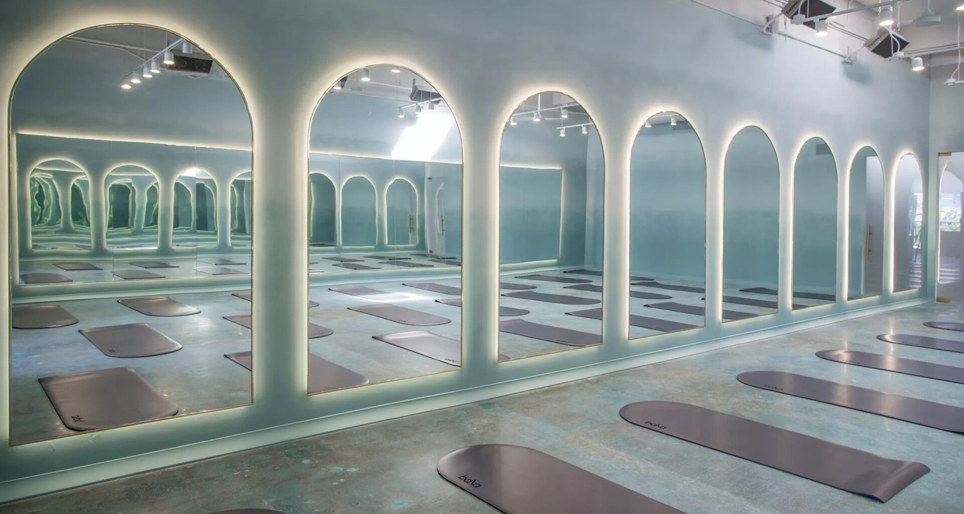 photo of a room with domed mirrors and domed mats on the ground
