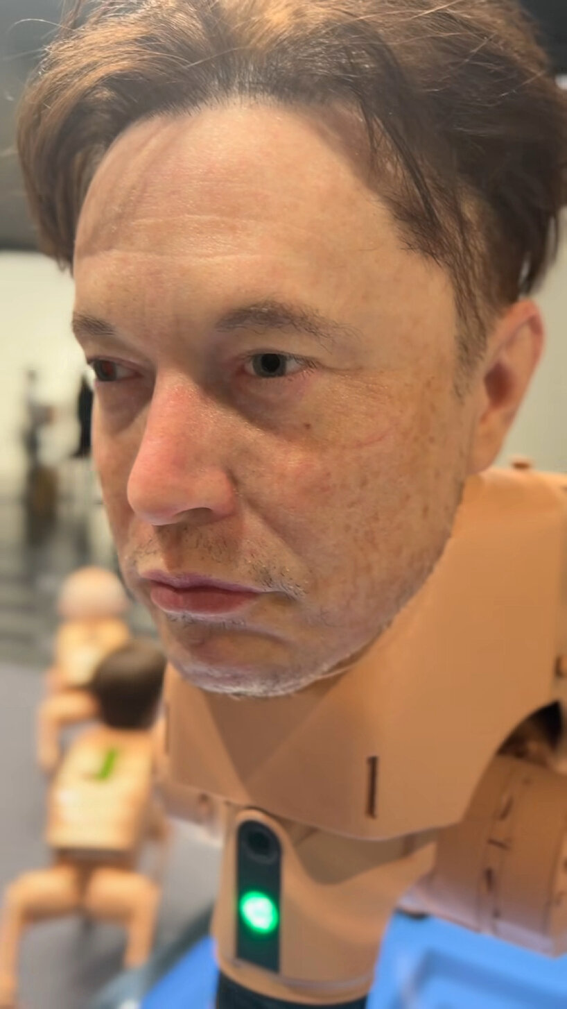 detailed view of Elon Musk's head at the Art Basel Miami installation space