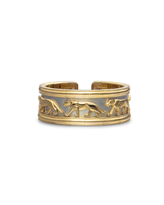 a gold bracelet featuring animal engravings
