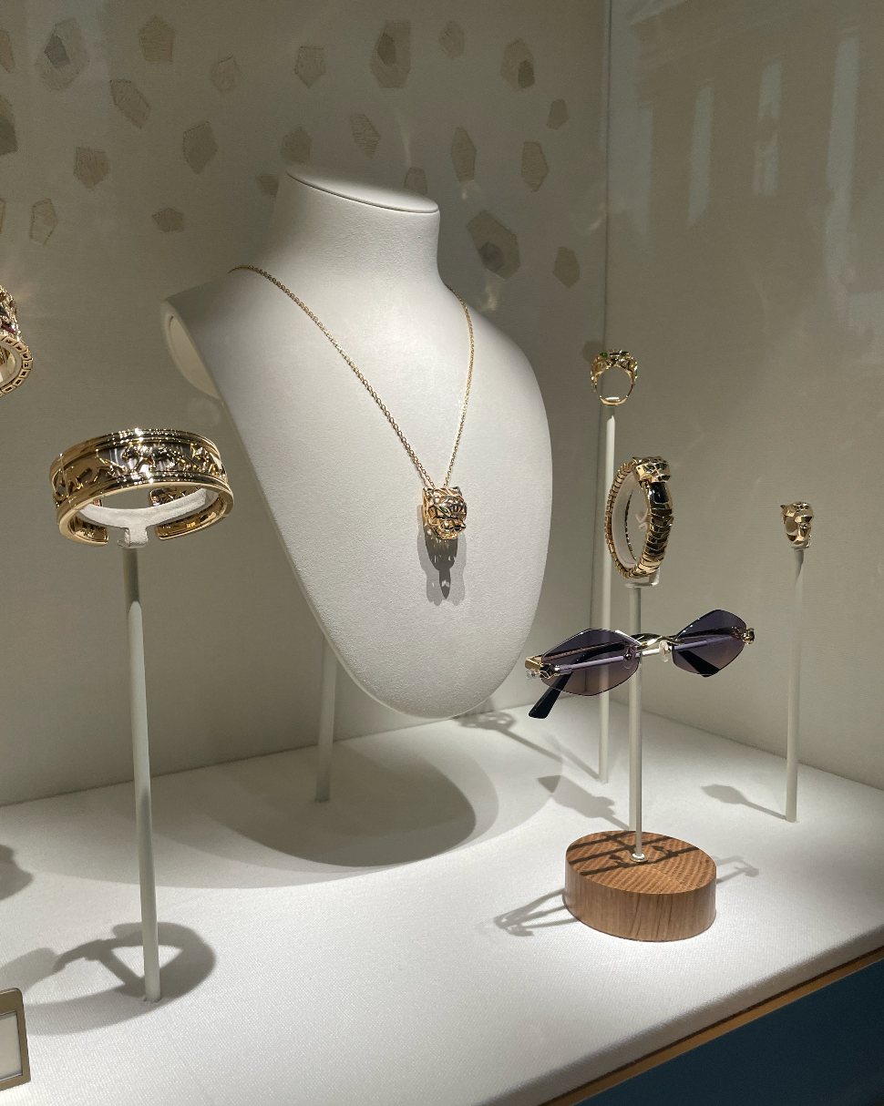 display of luxury jewelry and sunglasses
