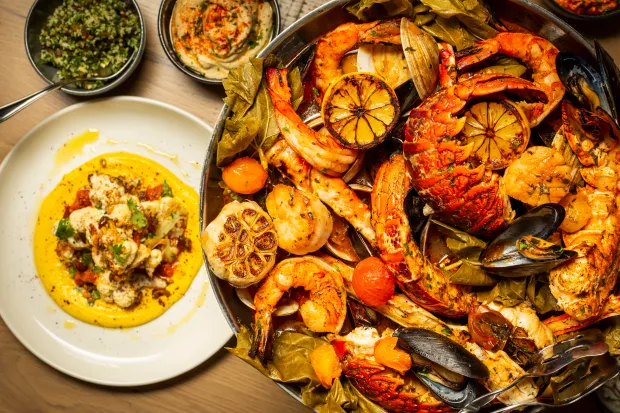 An open-roasted shellfish platter at Del Mar, which expects to open its West Palm Beach location in the NORA District later this summer. (Chris Casella for Cameron Mitchell Restaurants / Courtesy)