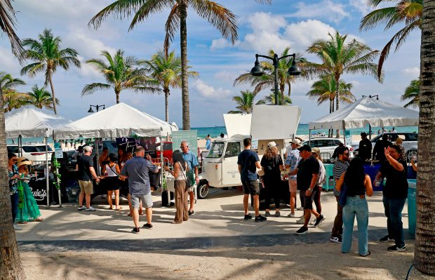 People gather at the Grand Tasting for Visit Lauderdale Food & Wine Festival at Las Olas Oceanside Park on Saturday January 18, 2025. (Mike Stocker/South Florida Sun Sentinel)