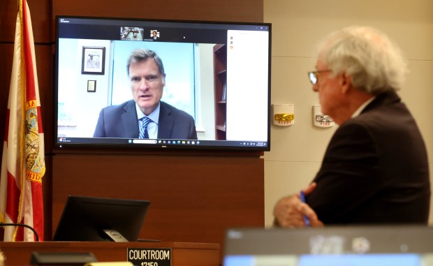Florida Supreme Court Chief Justice Carlos G. Muñiz testifies via Zoom during Broward County Judge Lauren Peffer's ethics hearing at the Broward County Courthouse in Fort Lauderdale, Tuesday, Dec. 16, 2025. Peffer faces an ethics charge for fabricated allegations of judicial misconduct in another county. (Carline Jean/South Florida Sun Sentinel)
