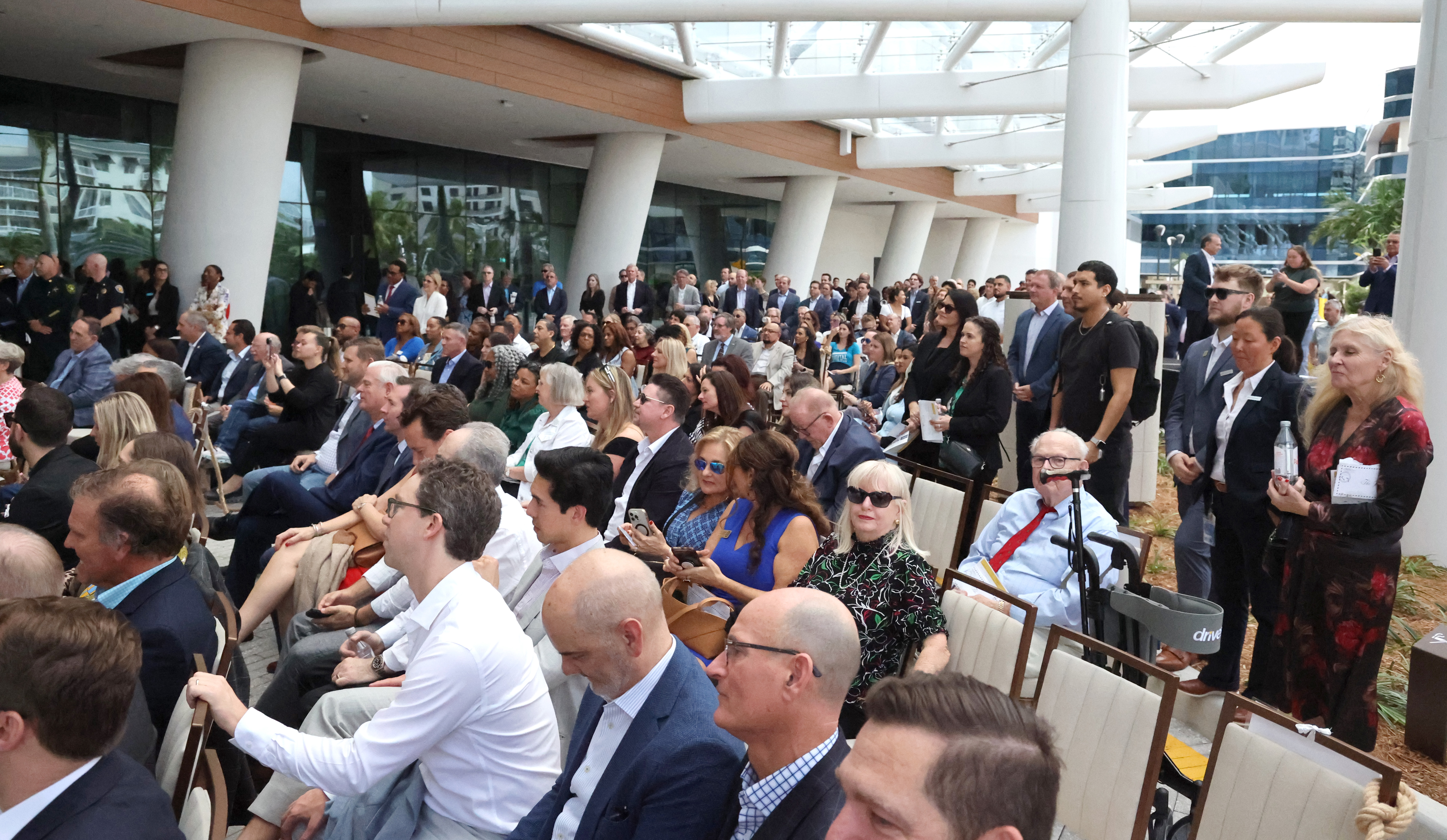 People attend the ribbon-cutting ceremony for the Omni Fort Lauderdale...