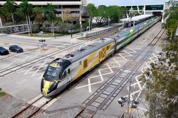 A southbound Brightline train eses out of the downtown Fort Lauderdale station at Broward Boulevard. (Mike Stocker/South Florida Sun Sentinel)