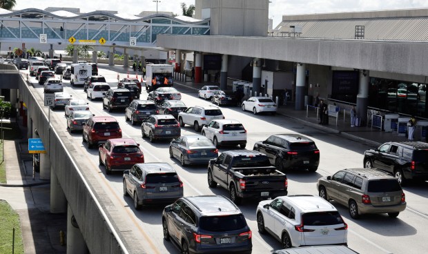 Vehicles navigate holiday traffic at Fort Lauderdale-Hollywood International Airport in Fort Lauderdale on Monday, Dec. 22, 2025. (Carline Jean/South Florida Sun Sentinel)