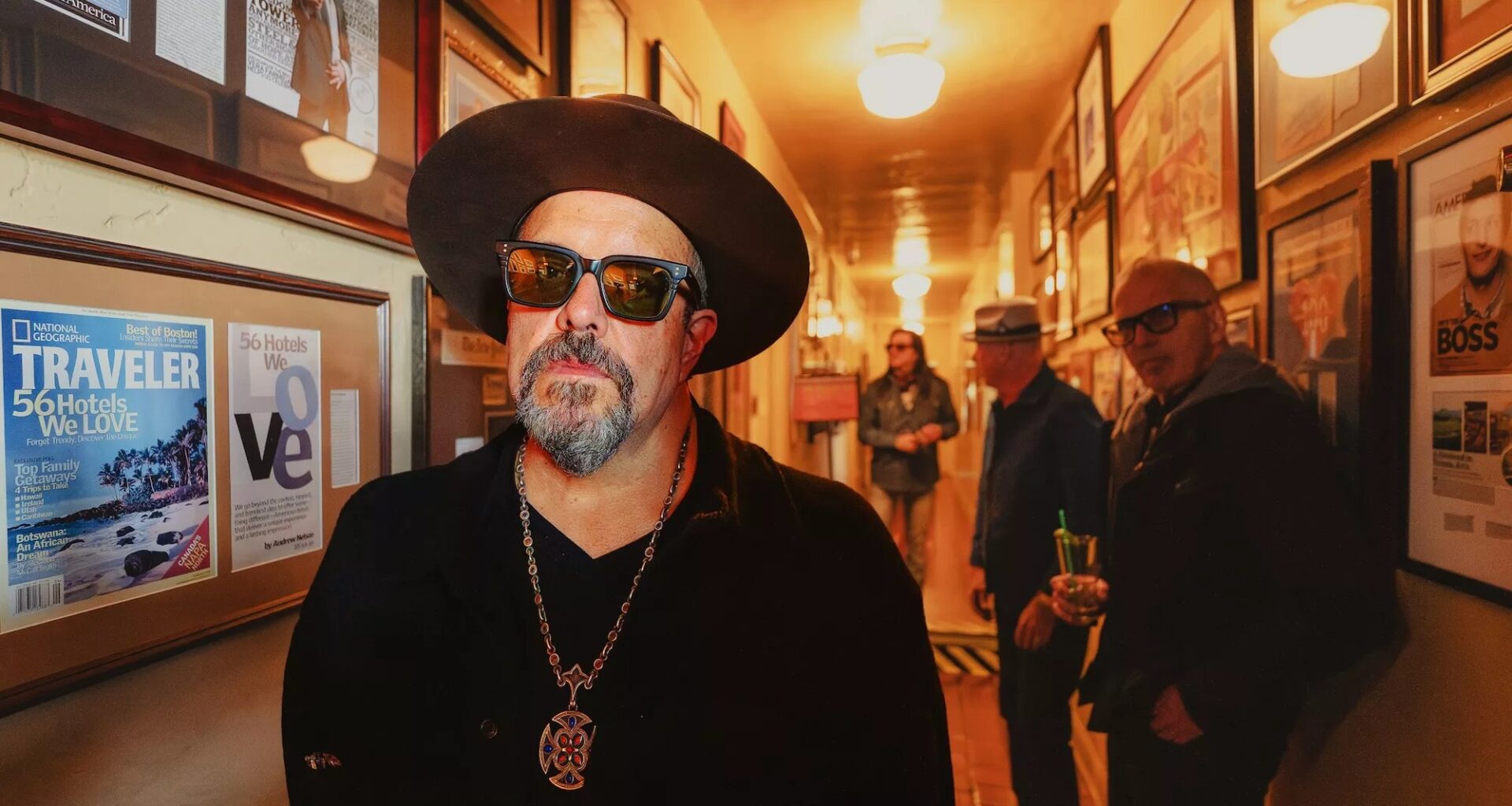 The four members of the Mavericks standing in a hallway
