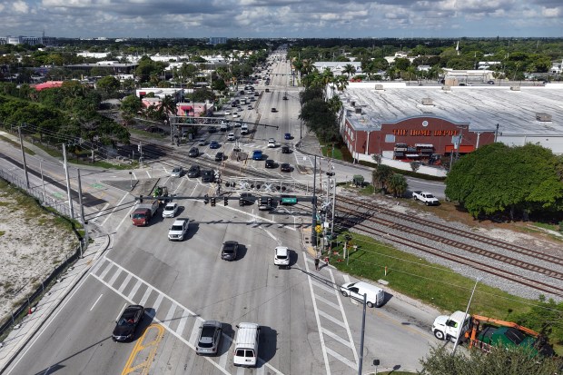 Cars cross railroad tracks on Sunrise Blvd. near Federal Hwy. in Fort Lauderdale on Wednesday, Oct. 22, 2025. Transportation planners are studying the possibility of building tunnels under the tracks at five major railroad crossings in Fort Lauderdale, but the expense would be huge. (Amy Beth Bennett / South Florida Sun Sentinel)