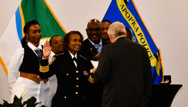 Deputy Chief Lovetta Quinn-Henry is surrounded by family as she is sworn in by Mayor Bryan Nelson on Thursday, Oct. 30, 2025 as the new chief of police for the Apopka Police Department at the Apopka Community Center. She is the first woman to hold the position. She came from the Orlando Police Department where she spent 25 years and rose to the position of deputy chief. (Courtesy Apopka Police Department)