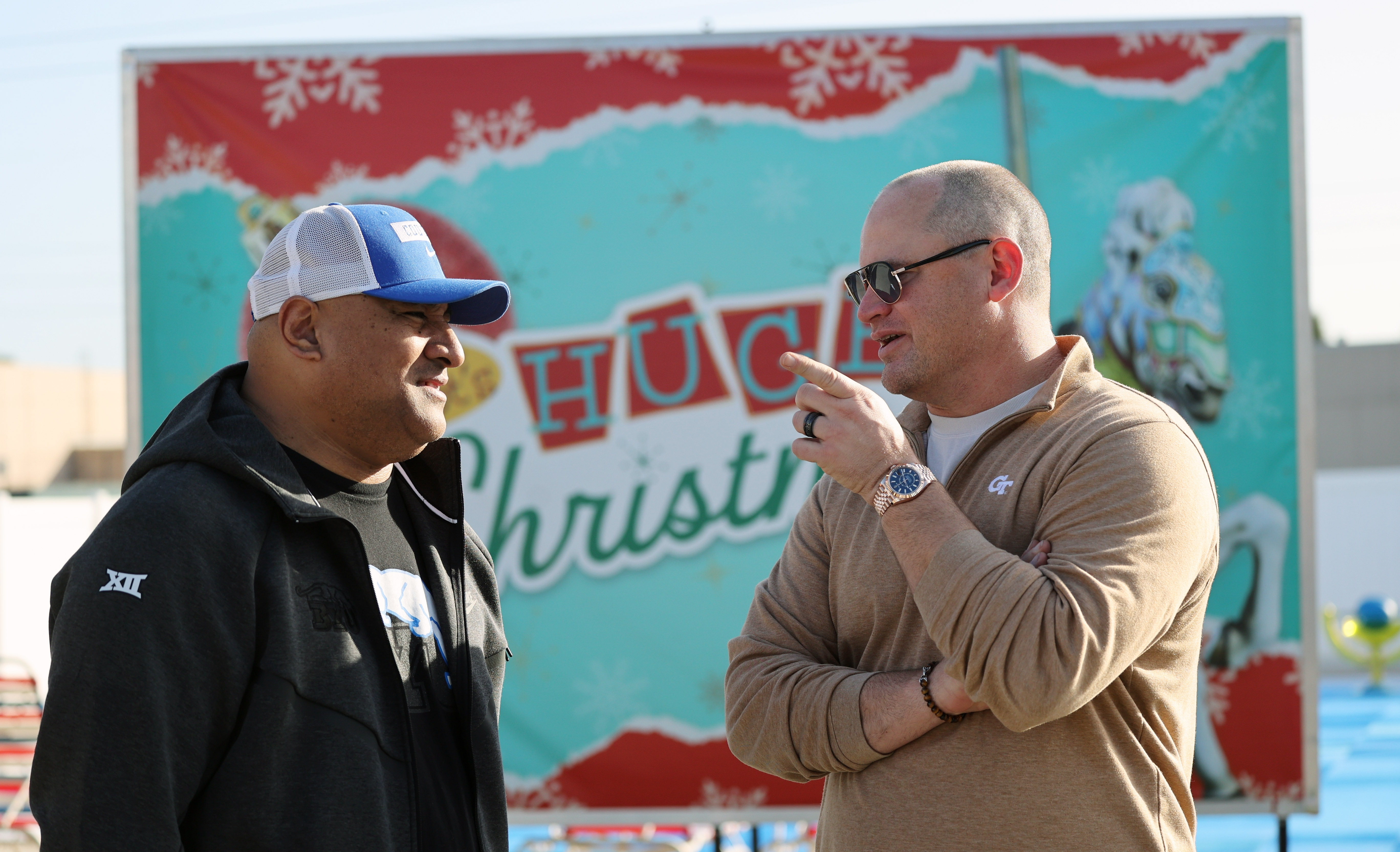 Left to Right, Brigham Young University football head coach Kalani...