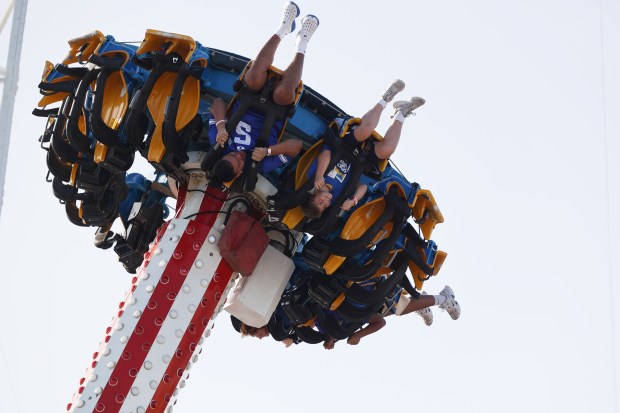 Football players from the 36th annual Pop-Tarts Bowl teams, Georgia Tech and Brigham Young University, join central Florida children for a morning of fun at Fun Spot America, on Tuesday, December 23, 2025. (Ricardo Ramirez Buxeda/Orlando Sentinel)
