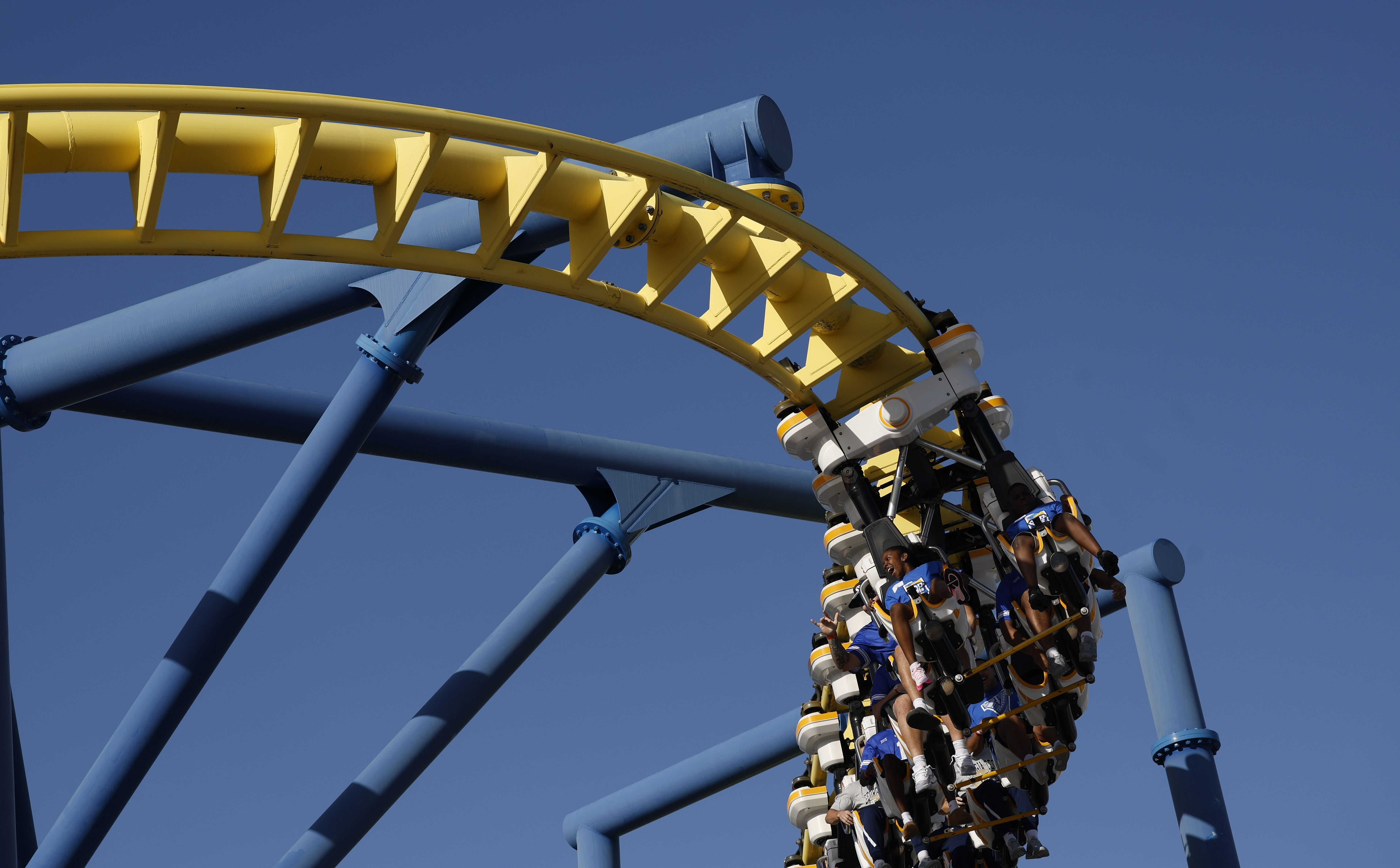 Football players and central Florida children ride the Freedom Flyer...
