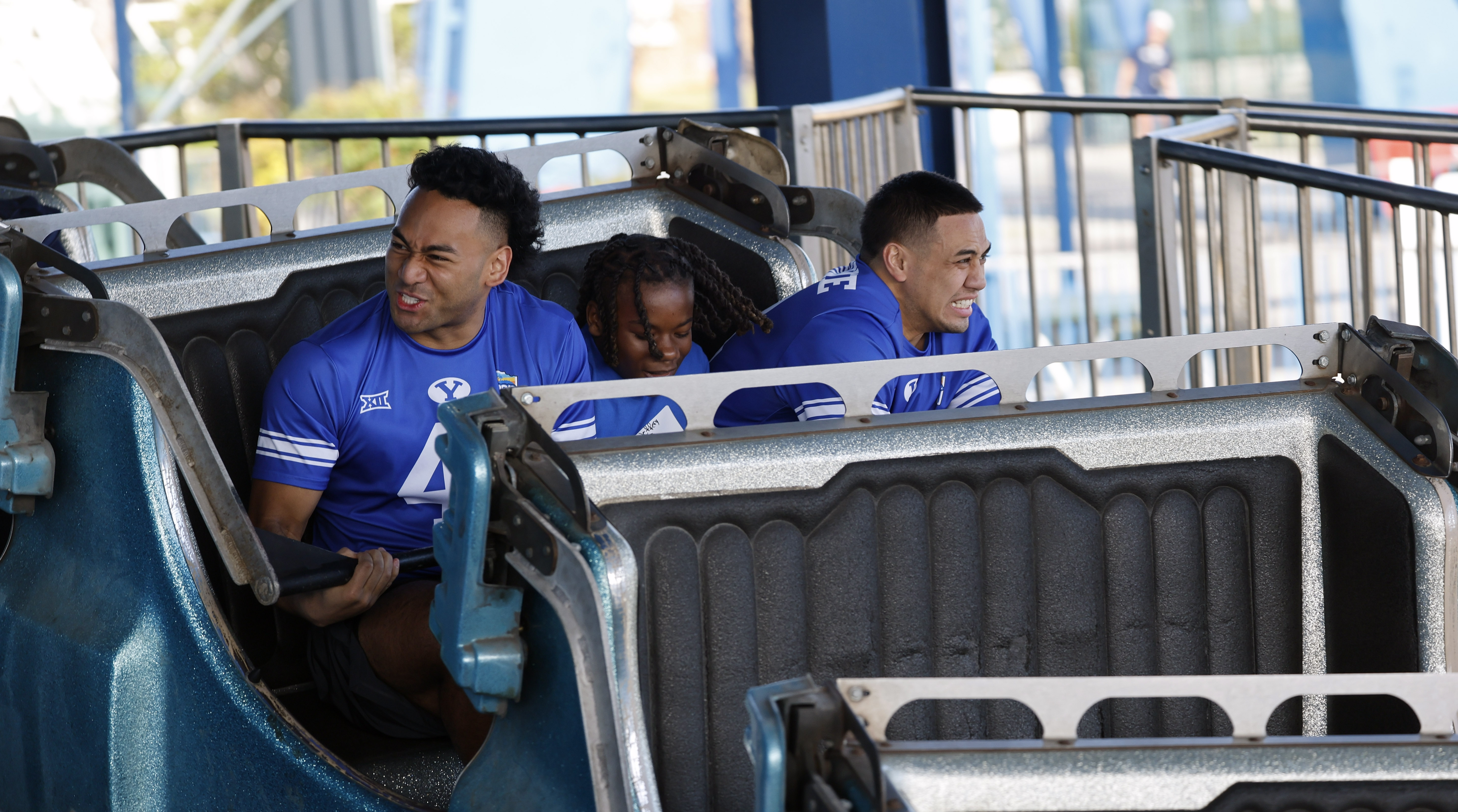 Football players and central Florida children ride the Rip Curl...