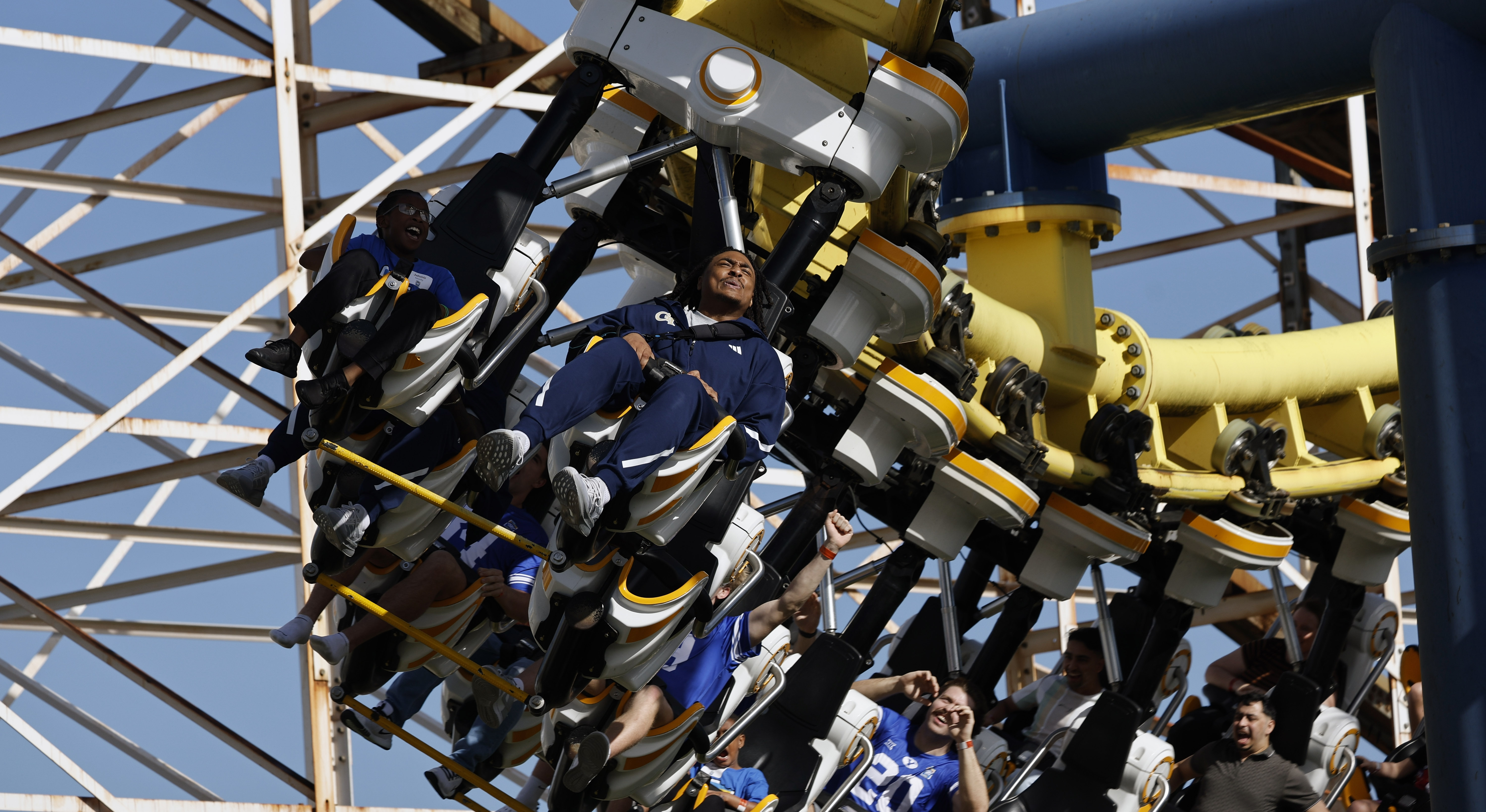 Football players and central Florida children ride the Freedom Flyer...